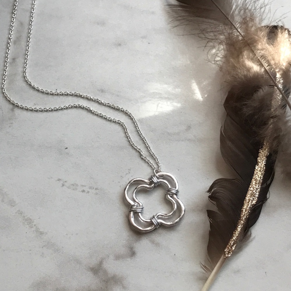 Silver tone wire wrapped necklace.
